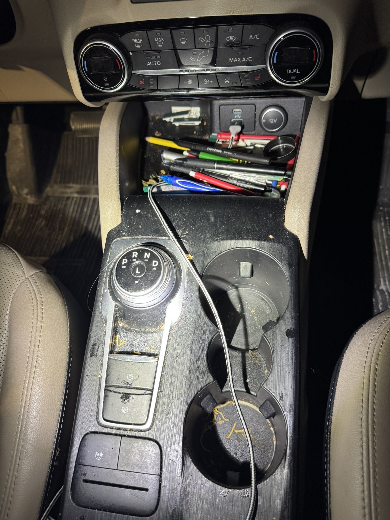 Before: dusty center console and cup holders